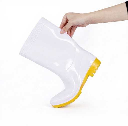 Workers in chemical processing facilities wearing protective acid and alkali resistant boots